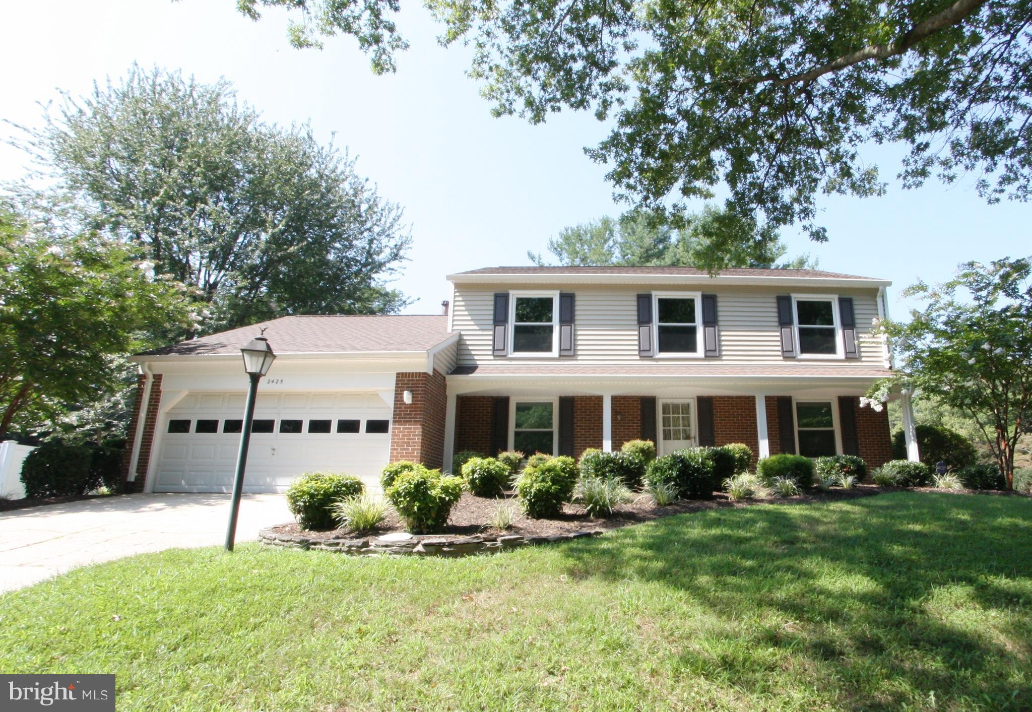 2425 Countryside Drive Silver Spring, MD 20905 - Photo 1 of 24 a front view of a house with a yard table and chairs