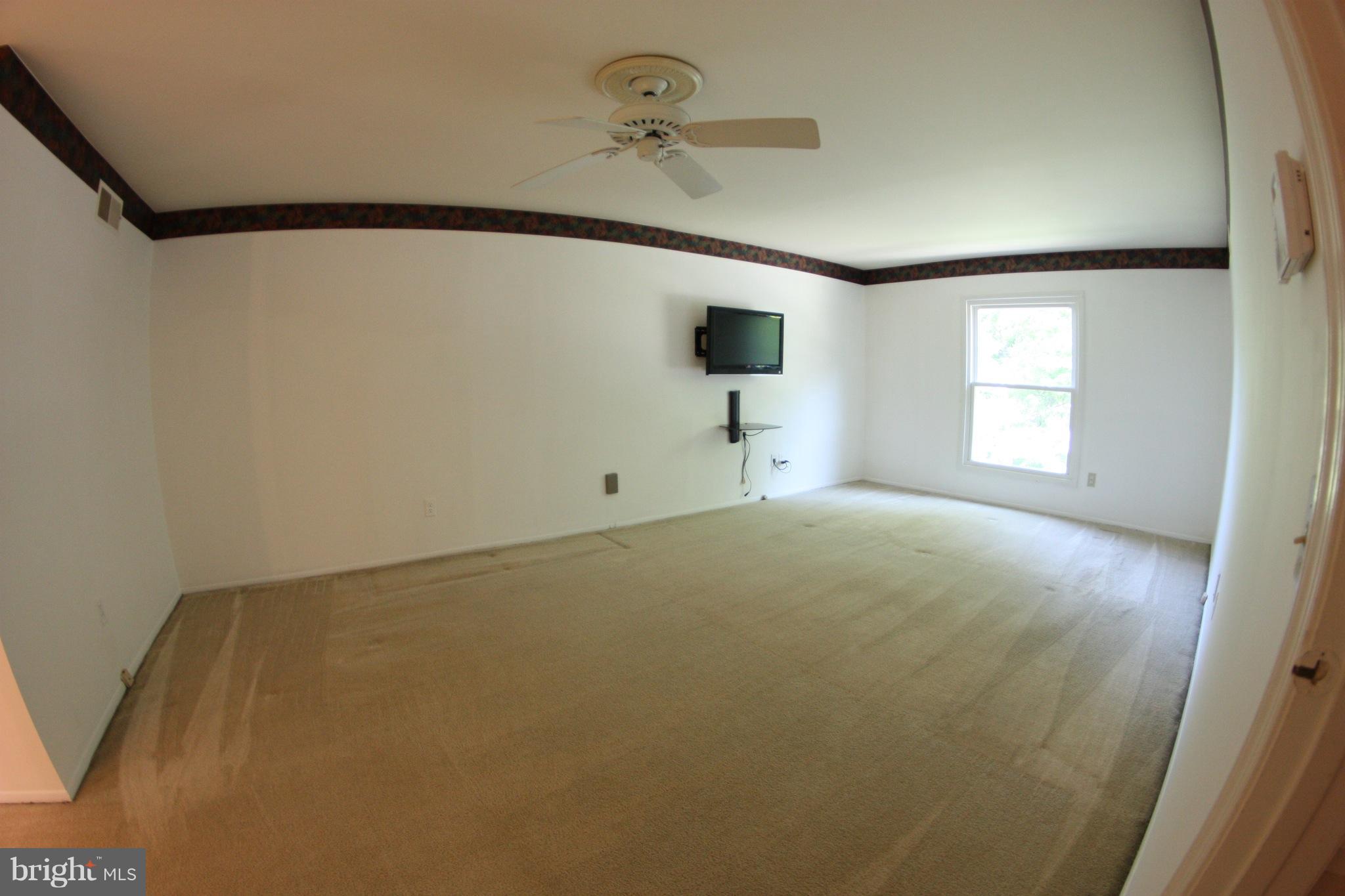2425 Countryside Drive Silver Spring, MD 20905 - Photo 19 of 24 a view of empty room with windows