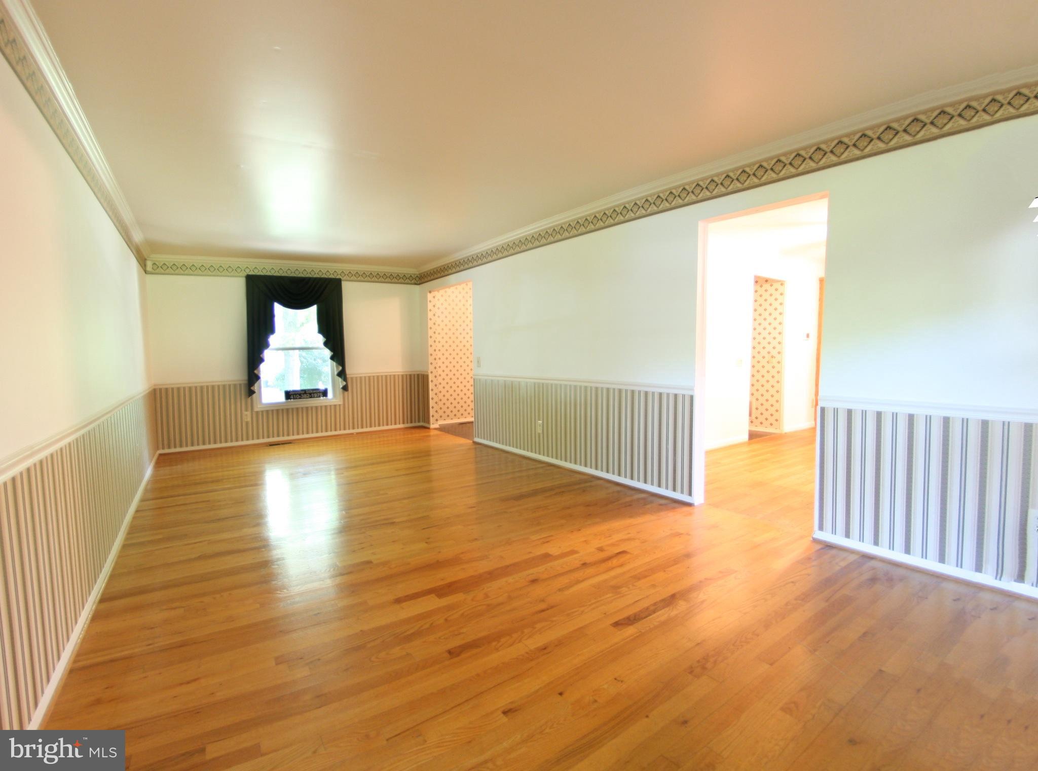 2425 Countryside Drive Silver Spring, MD 20905 - Photo 3 of 24 a view of a room with wooden floor