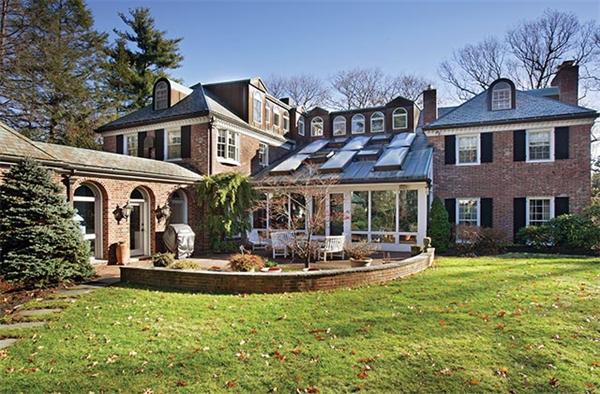 145 Lee Street Brookline, MA 02445 - Photo 12 of 12 a front view of a house with swimming pool and garden