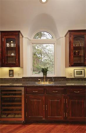 145 Lee Street Brookline, MA 02445 - Photo 8 of 12 a kitchen with granite countertop a sink and a window