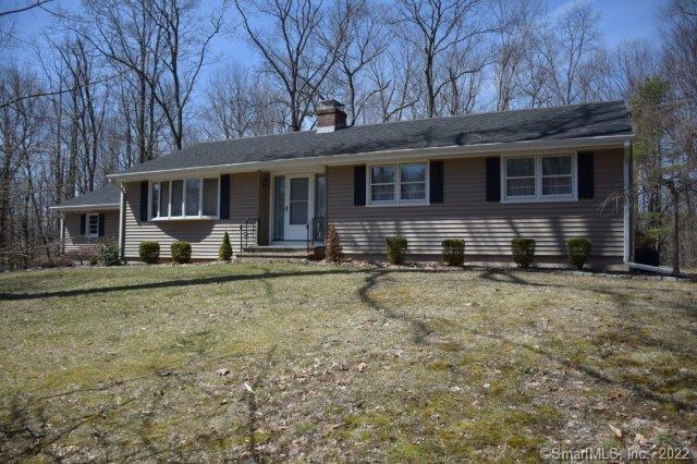 309 Miller Road Bethany, CT 06524 - Photo 1 of 1 a front view of a house with garden