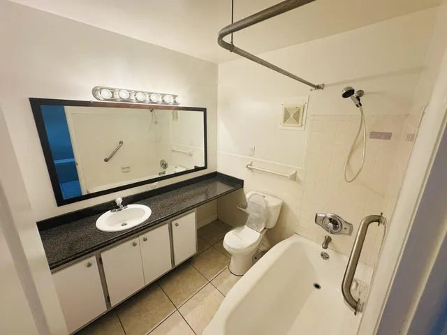 a view of an empty room and wooden floor