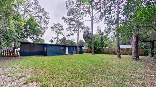 a view of a backyard with a small cabin