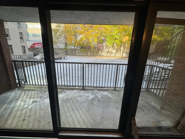 a view of a porch with wooden floor