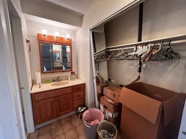 a bathroom with a sink and mirror