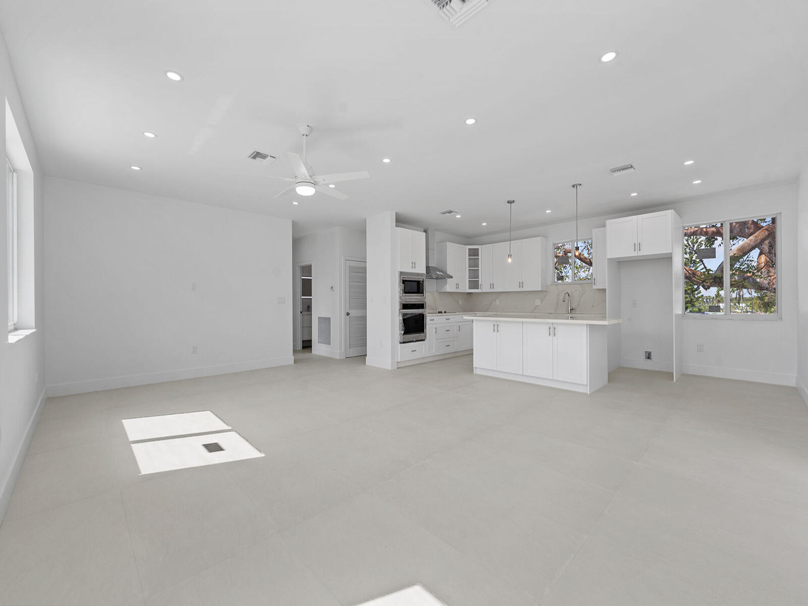 101 Kay Drive Key Largo, FL 33037 - Photo 16 of 71 a view of kitchen with refrigerator and window