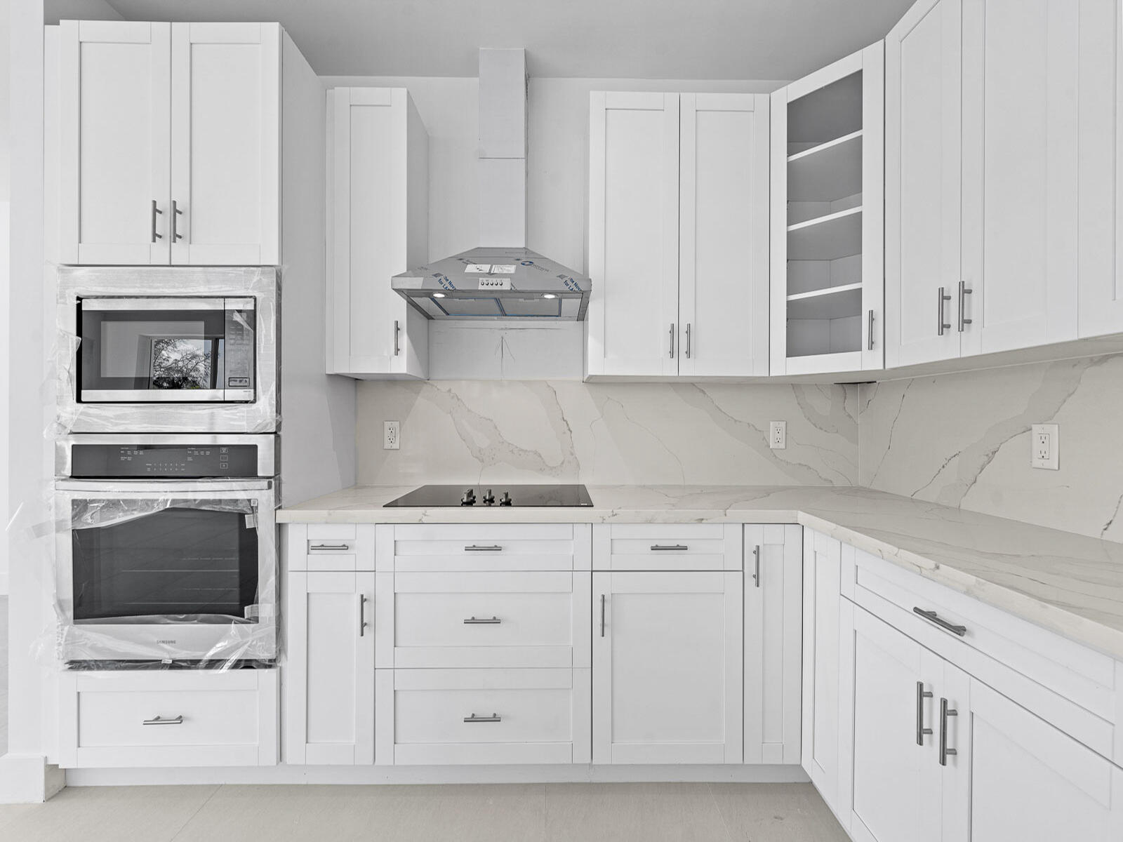 101 Kay Drive Key Largo, FL 33037 - Photo 23 of 71 a kitchen with white cabinets and appliances