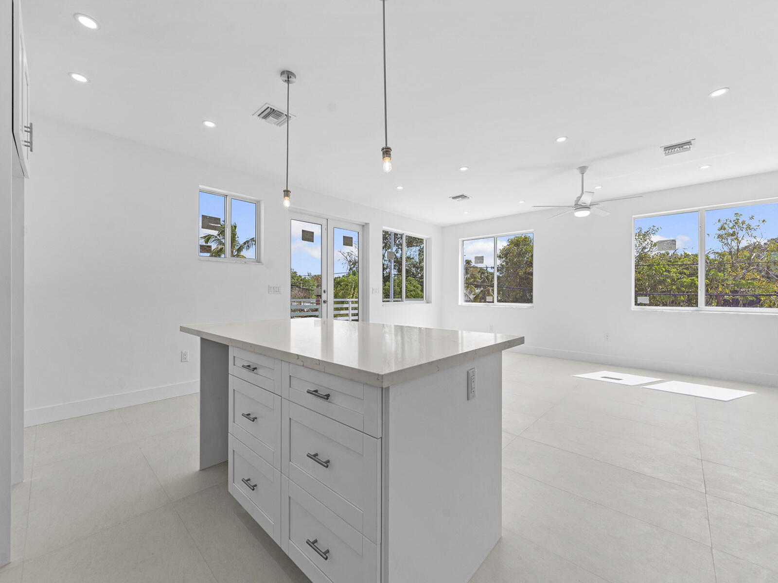 101 Kay Drive Key Largo, FL 33037 - Photo 25 of 71 a kitchen with stainless steel appliances granite countertop a sink a window and a counter top space