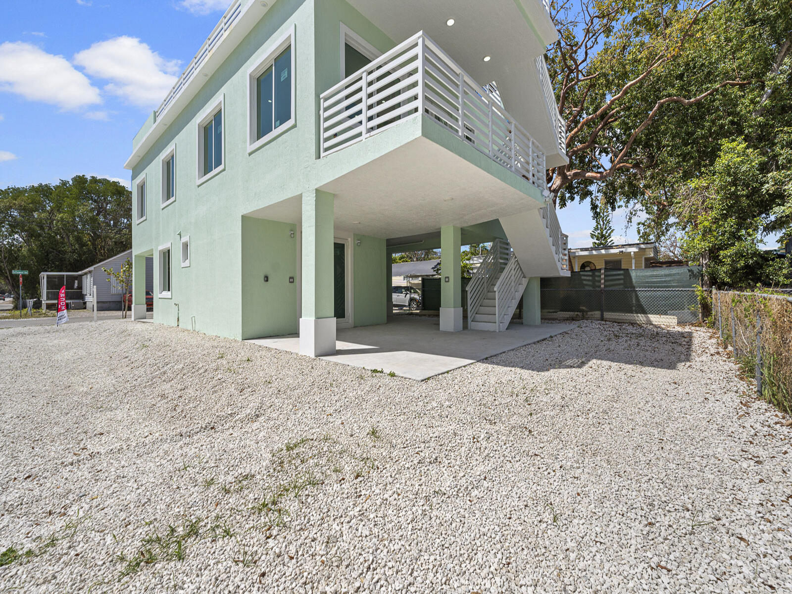 101 Kay Drive Key Largo, FL 33037 - Photo 56 of 71 a view of a house with a yard and sitting area