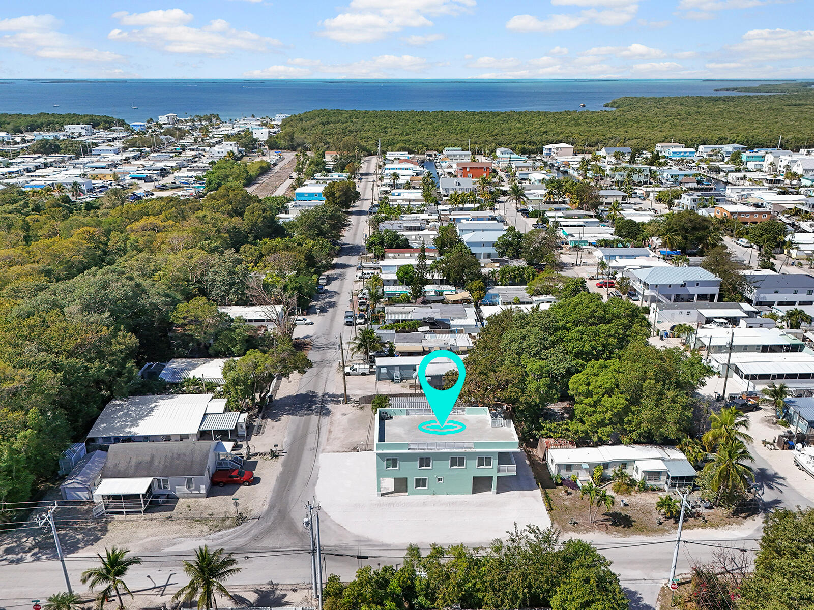 101 Kay Drive Key Largo, FL 33037 - Photo 62 of 71 an aerial view of residential houses with outdoor space and ocean view