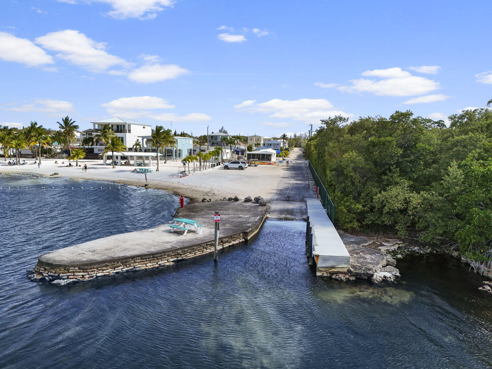 101 Kay Drive Key Largo, FL 33037 - Photo 67 of 71 a view of a swimming pool and lounge chair