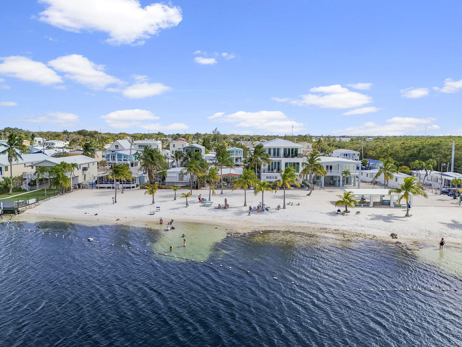 101 Kay Drive Key Largo, FL 33037 - Photo 68 of 71 a view of a swimming pool with a lounge chair and city view