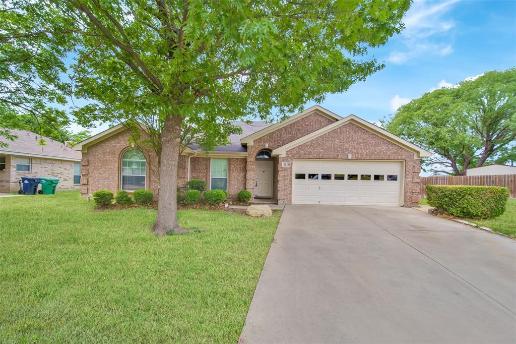 4221 Fiste Denton, TX 76207 - Photo 1 of 26 Ranch-style home featuring a garage and a front lawn