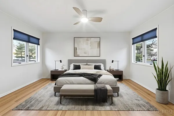a bed room with a bed and a chair