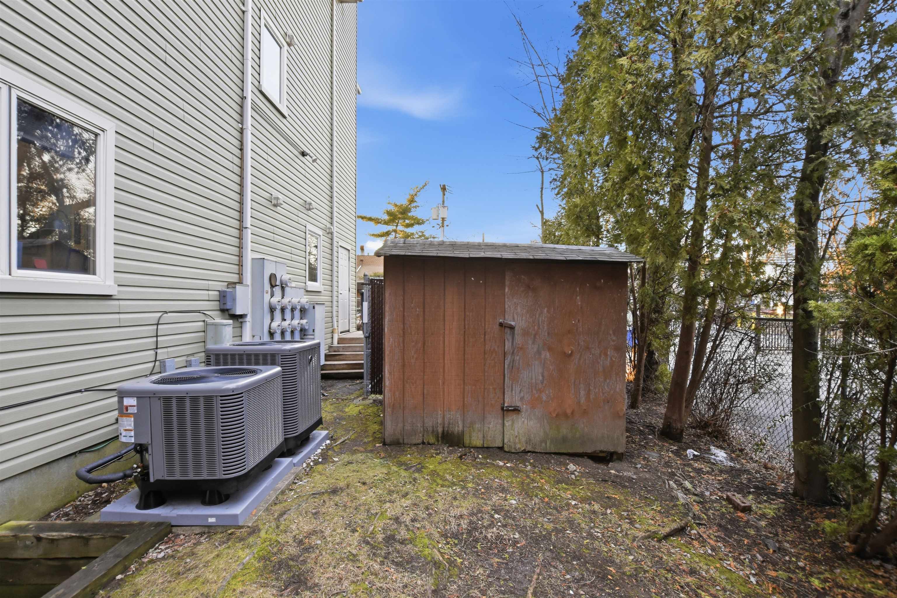 700 10th Street, Unit 1 Secaucus, NJ 07094 - Photo 15 of 21 a view of a deck yard with large tree