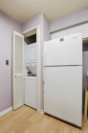 a white refrigerator freezer and a dishwasher sitting in a kitchen