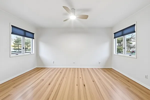 a view of room with window and ceiling fan
