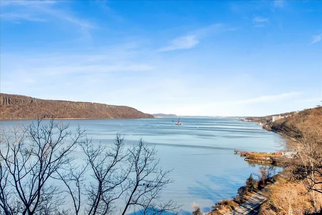 a view of an ocean and mountain