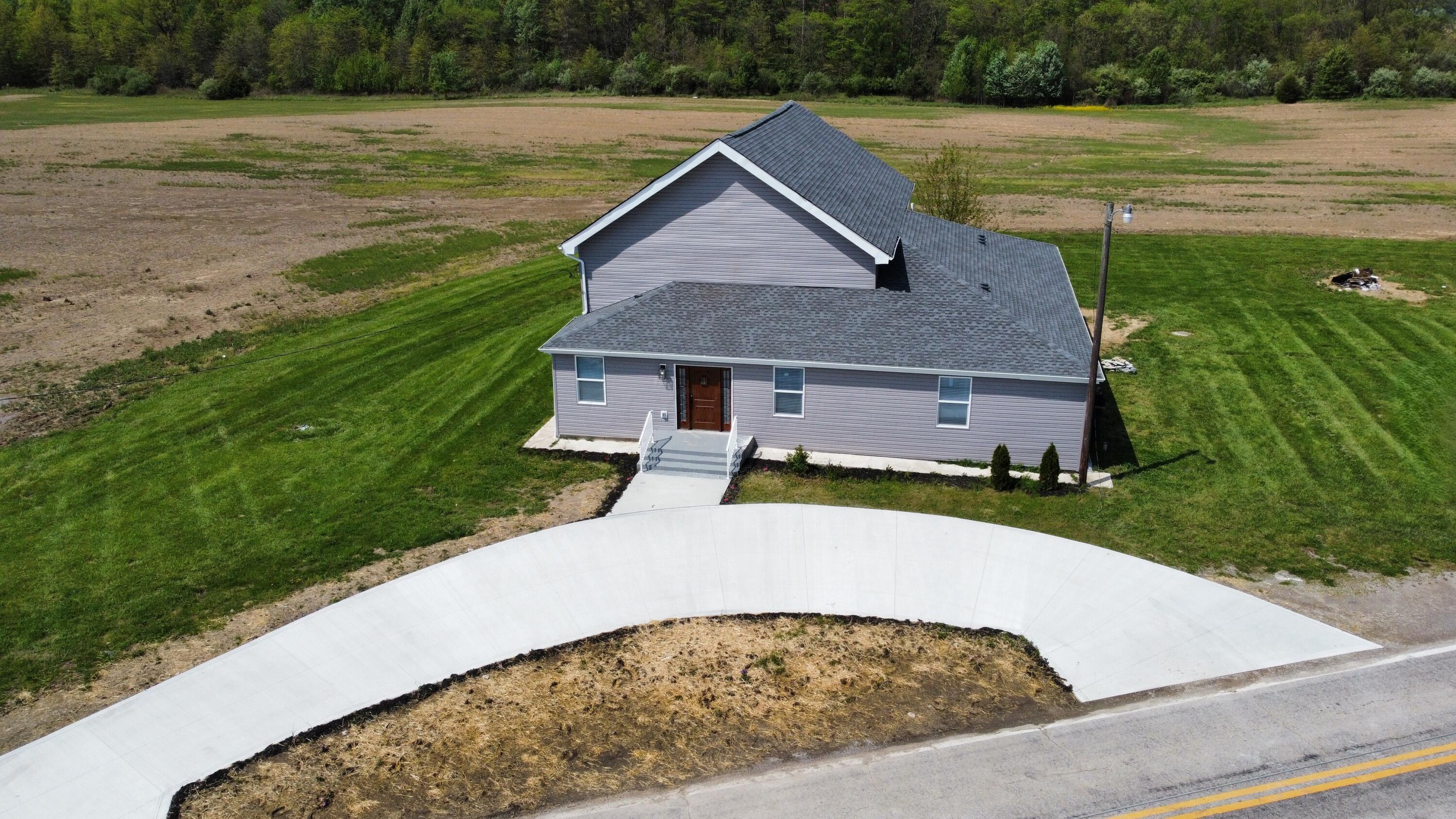 Main Photo of the house with driveway