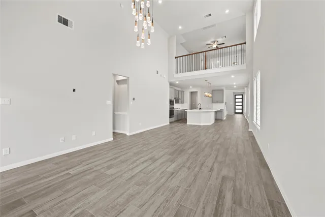 a view of a room with wooden floor