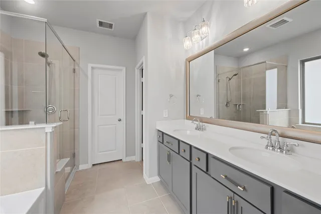a bathroom with a sink double vanity and a mirror