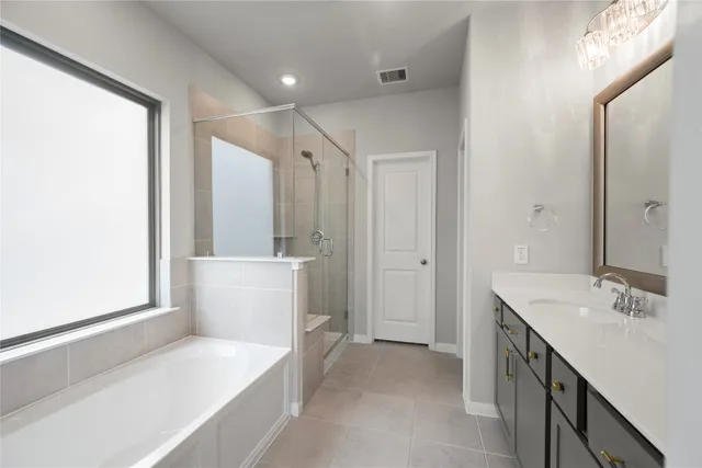 a bathroom with a sink a mirror and a bathtub