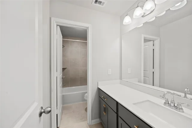 a bathroom with a sink a vanity and a mirror