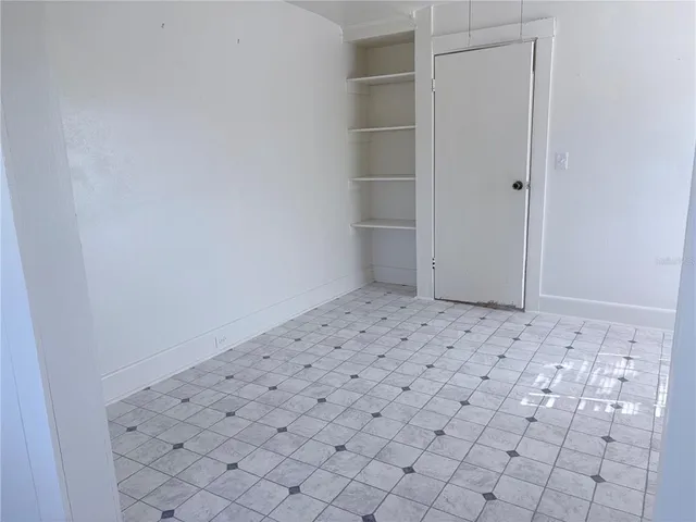 an empty room with a wooden floor