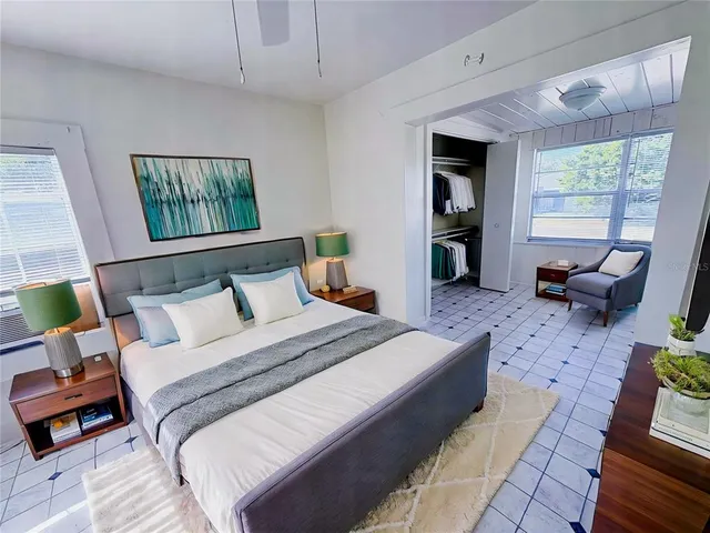 a bed room with a bed and a couch