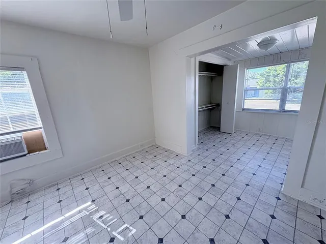 a view of a hallway to room with window