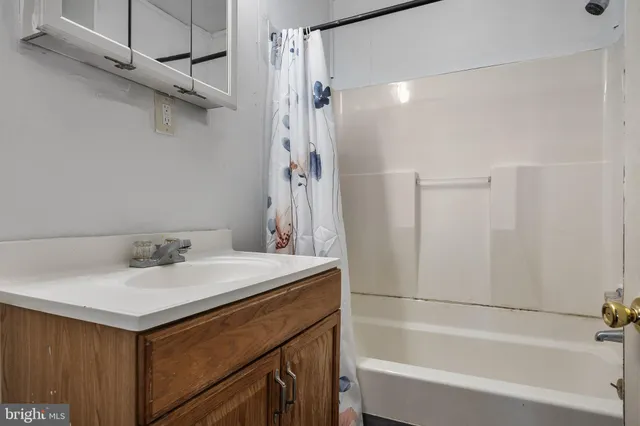 a view of a hallway to rooms