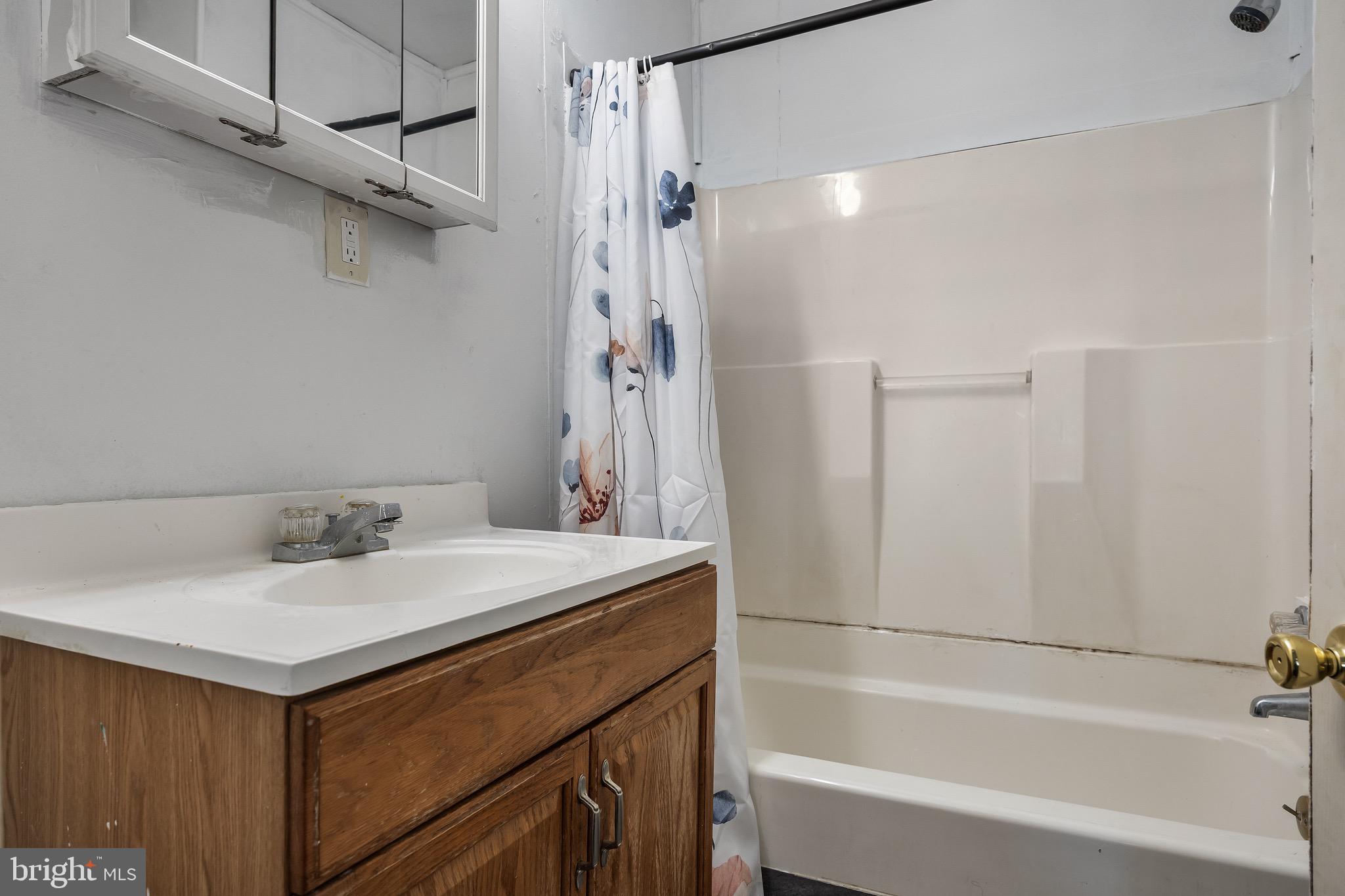 303 Pine Street Carneys Point, NJ 08069 - Photo 11 of 34 a bathroom with a sink vanity tub and shower