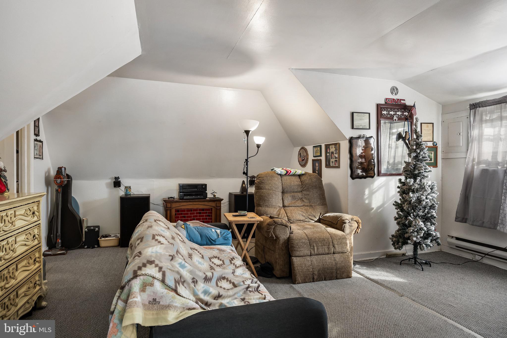 303 Pine Street Carneys Point, NJ 08069 - Photo 14 of 34 a bed room with furniture and a flat screen tv