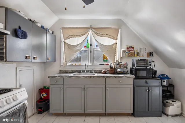 a kitchen with cabinets and appliances