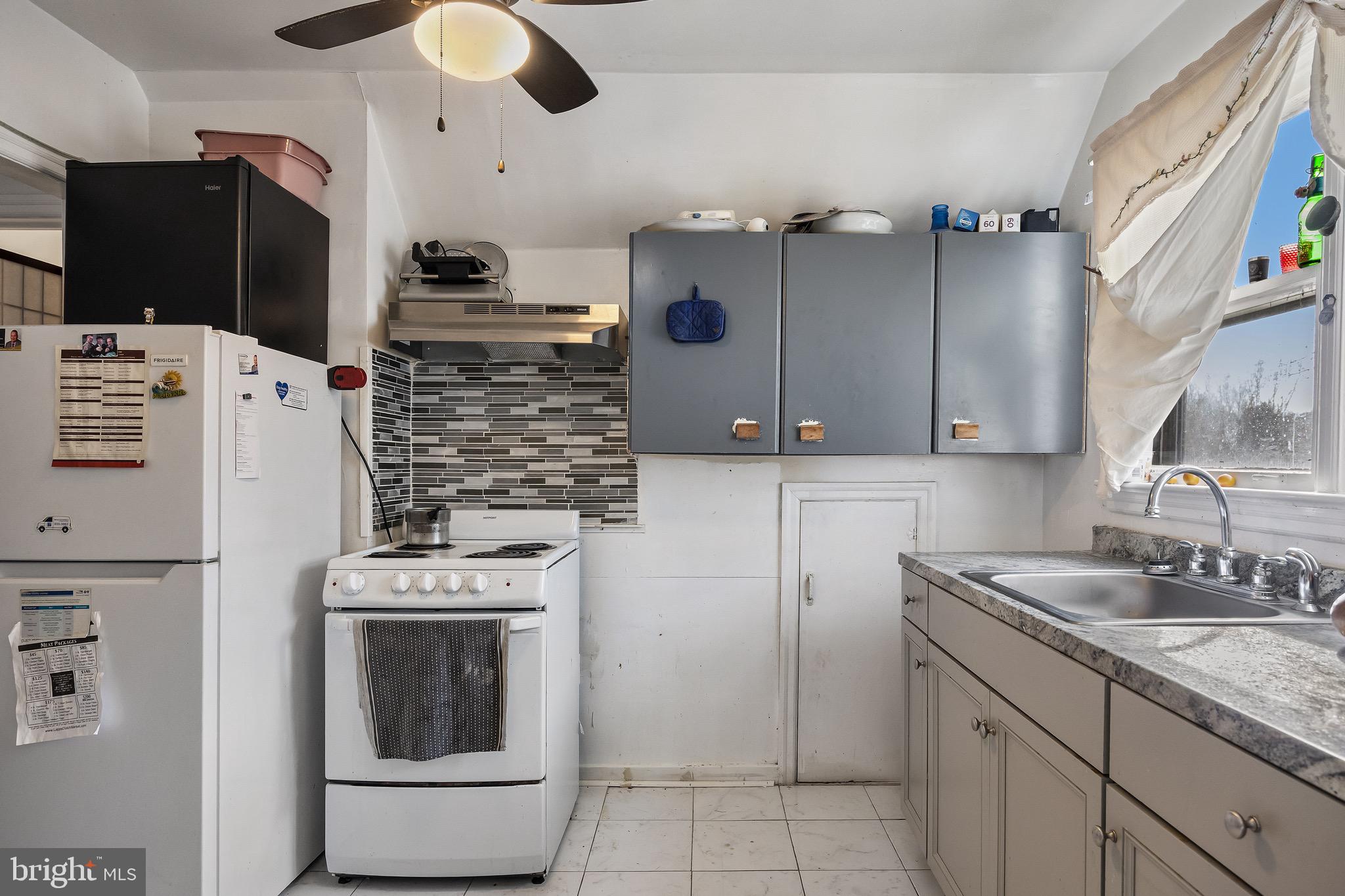 303 Pine Street Carneys Point, NJ 08069 - Photo 18 of 34 a kitchen with cabinets and appliances