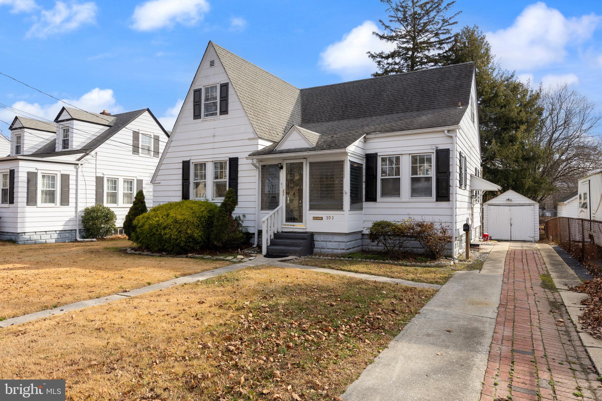 303 Pine Street Carneys Point, NJ 08069 - Photo 2 of 34 a front view of a house with a yard