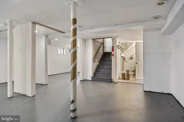 a bathroom with a toilet a sink and a mirror