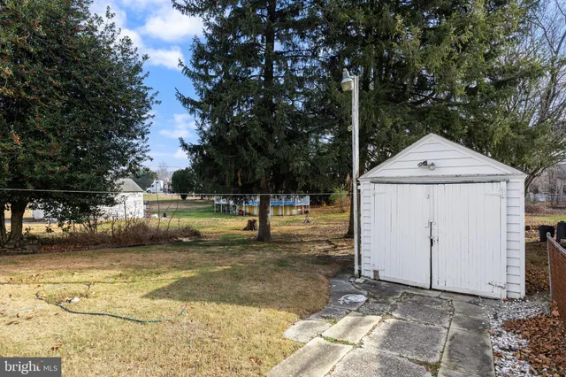 a view of a yard with swimming pool