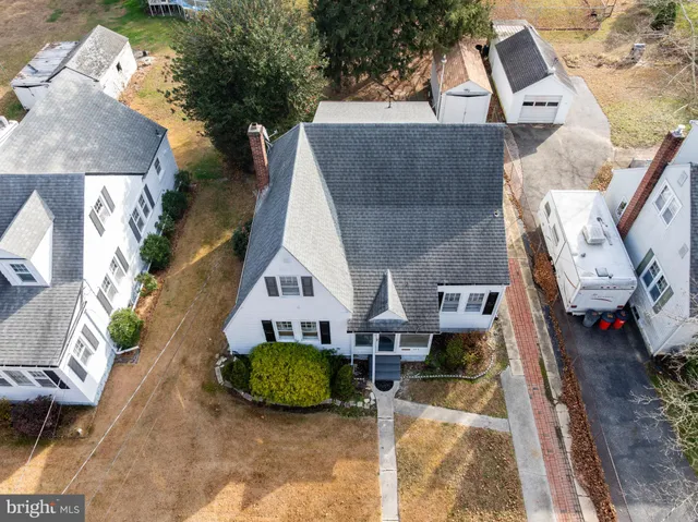 an aerial view of a house with a yard