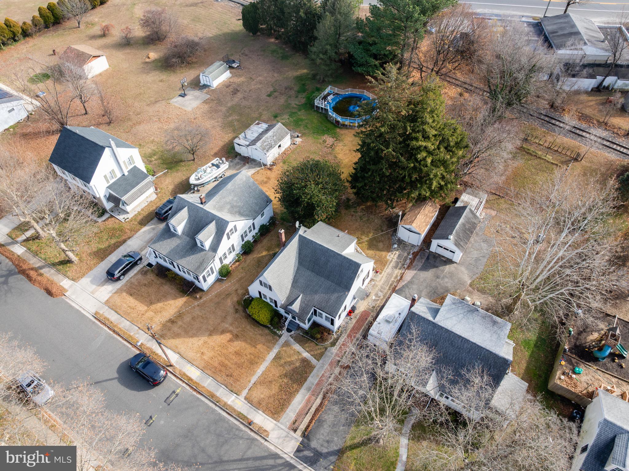 303 Pine Street Carneys Point, NJ 08069 - Photo 30 of 34 an aerial view of a house with a yard