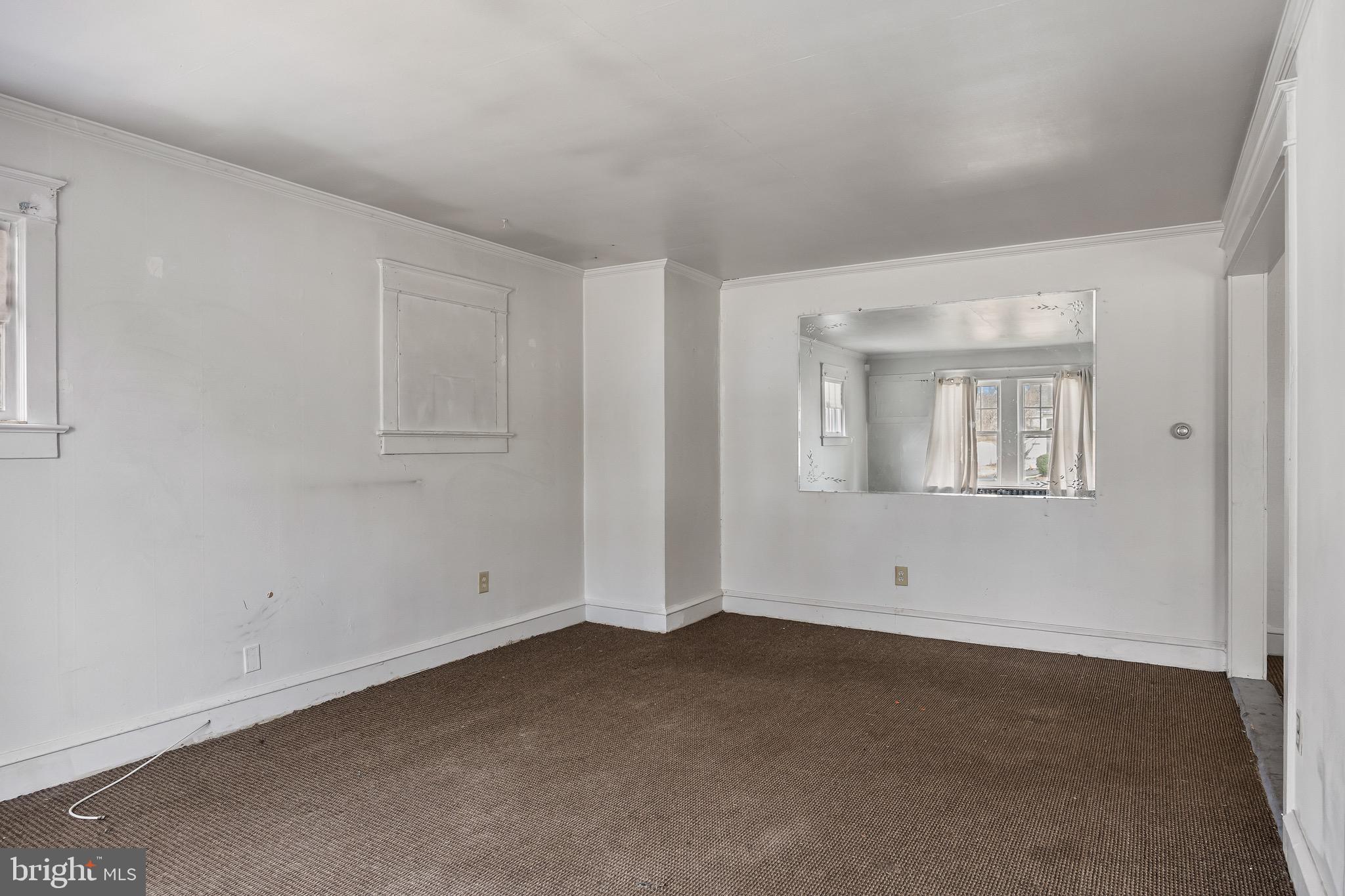 303 Pine Street Carneys Point, NJ 08069 - Photo 5 of 34 an empty room with windows