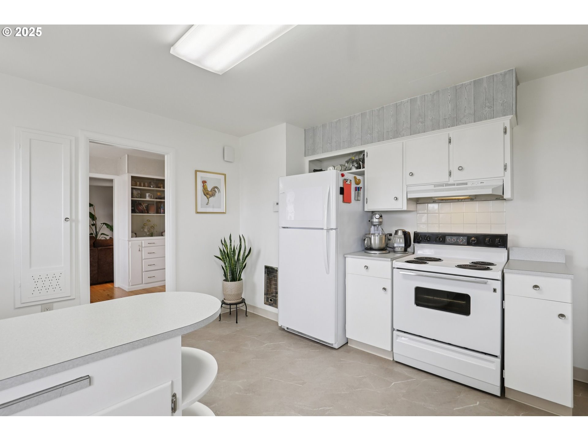 4535 Southwest Golf Course Road Cornelius, OR 97113 - Photo 17 of 43 a kitchen with white cabinets and white appliances