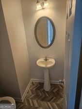 9432 Lakeview Road Union City, GA 30291 - Photo 5 of 11 a bathroom with a sink toilet and a mirror