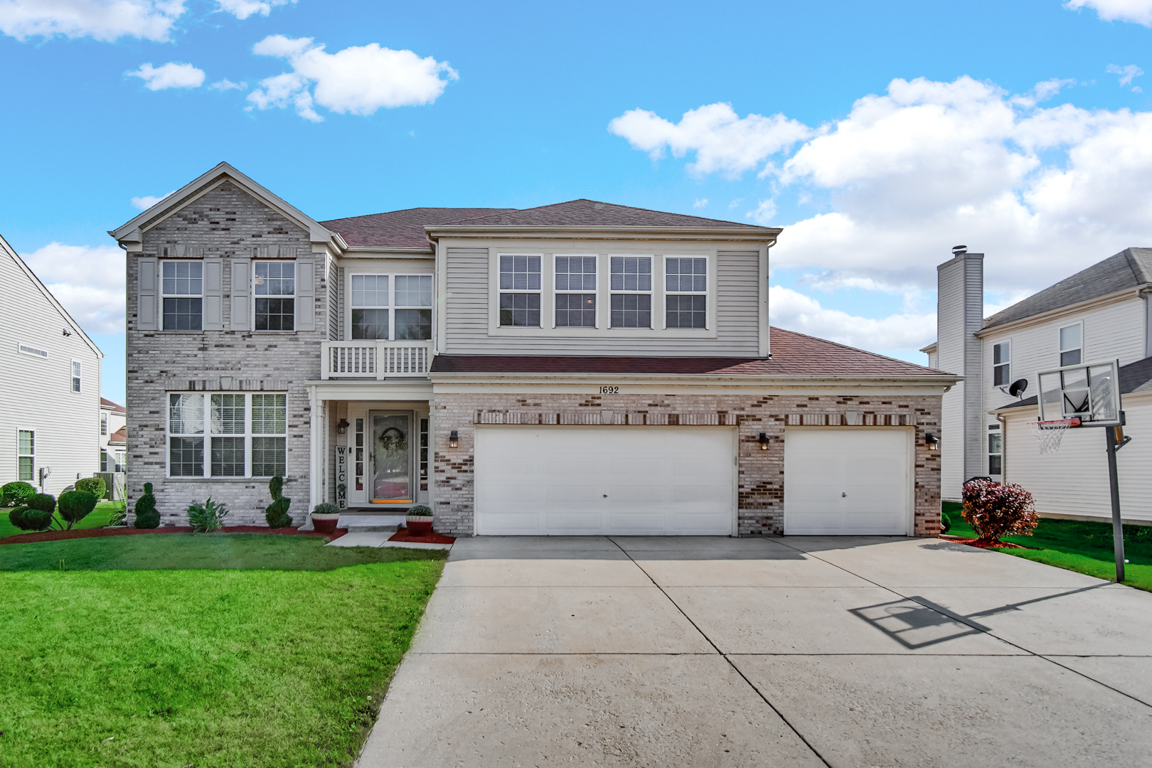 1692 Trails End Lane Bolingbrook, IL 60490 - Photo 2 of 3 a view of a white house with a yard