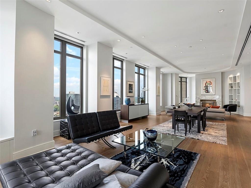 3376 Peachtree Road Northeast, Unit 44B Atlanta, GA 30326 - Photo 12 of 58 a living room with furniture and a large window