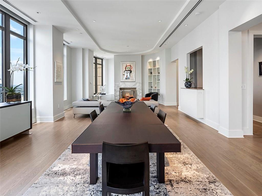 3376 Peachtree Road Northeast, Unit 44B Atlanta, GA 30326 - Photo 13 of 58 a living room with fireplace furniture and a wooden floor