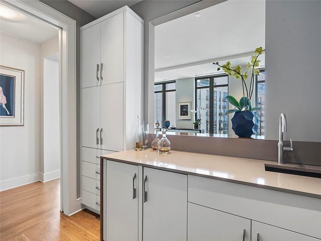 3376 Peachtree Road Northeast, Unit 44B Atlanta, GA 30326 - Photo 14 of 58 a bathroom with a sink and a mirror