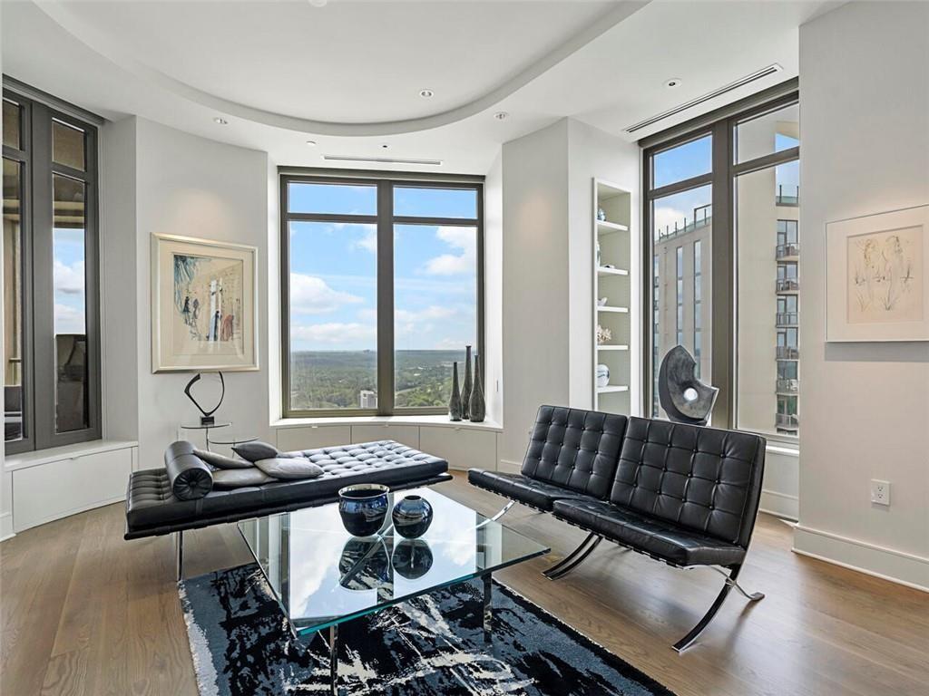 3376 Peachtree Road Northeast, Unit 44B Atlanta, GA 30326 - Photo 17 of 58 a living room with furniture and a large window