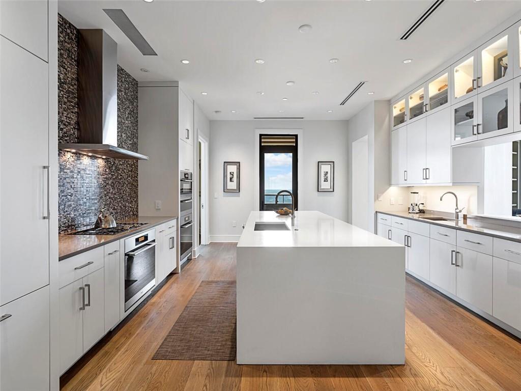3376 Peachtree Road Northeast, Unit 44B Atlanta, GA 30326 - Photo 21 of 58 a large kitchen with cabinets a sink and appliances